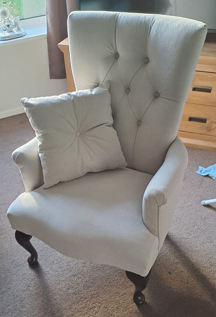 Victorian wingback armchair after restoration, upholstered in premium textured linen fabric